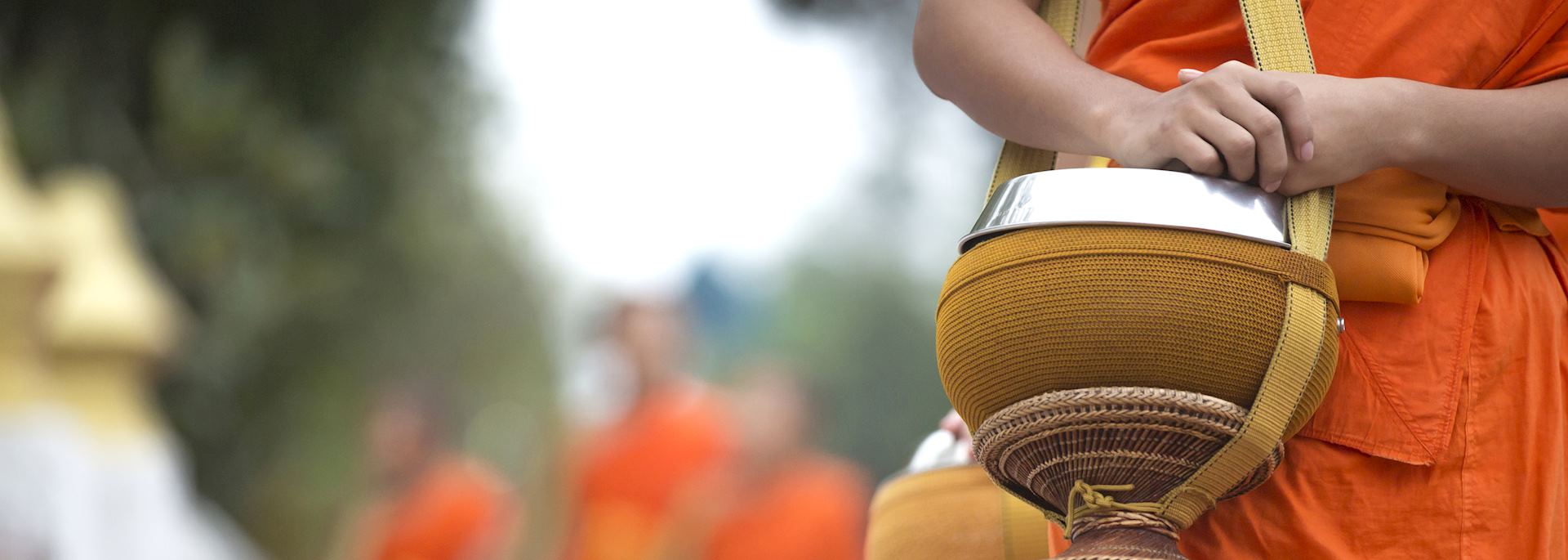 Alms giving by Buddhist monks in Luang Prabang